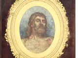 tableau représentant Jésus dans un cadre doré sur fond blanc