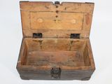an old wooden chest with a metal latch on it