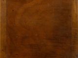 an old wooden tray with a handle on a white background