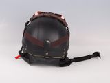 leather motorcycle helmet on a white background with a red strap