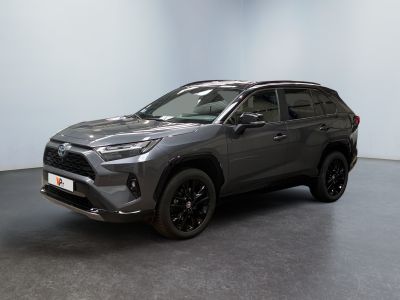 a grey toyota rav parked in a large room