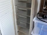 a refrigerator with a freezer and a toaster oven in it