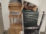 a pile of boxes and a lamp on top of a table