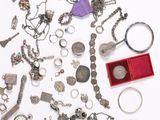 a lot of silver items on a white surface