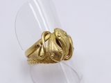 an image of a gold ring with a snake on top of it