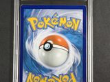 a close up of a pokemon card on a table