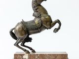 bronze statue of a horse on a marble base with a white background