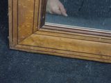 a reflection of a person ' s hand in a mirror