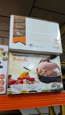 several boxes of pizza sit on top of a shelf in a store