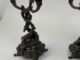 two candles that are sitting on top of a table
