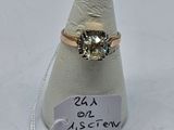 yellow diamond ring on a white cone with a price tag on it