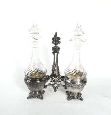 pair of antique silver plated decanters with glass vases