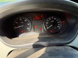 a close up of a car dashboard with a speedometer and gauges