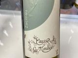 a bottle of wine that is being held by a person