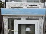 a pile of old windows sitting on top of a pallet