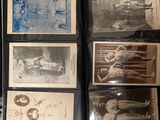 a lot of old baseball cards on display in a case
