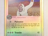 a pokemon card with a picture of a person holding a sword
