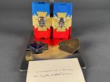 two red and blue lighters sitting on top of a table next to a piece of paper