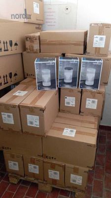 many boxes stacked on top of each other on the floor