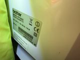 a label on the back of a white refrigerator