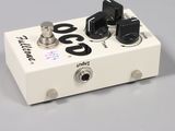 an image of a white guitar pedal sitting on top of a table