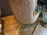 a chair that is sitting on a table in a room