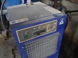 a blue machine that is sitting in a room
