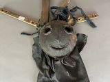 a picture of an old baseball glove and bat hanging on the wall