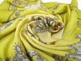 a close up of a yellow scarf with a picture of a horse on it