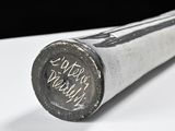 a baseball bat with writing on it sitting on a table