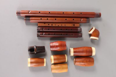 a lot of different types of musical instruments on the table