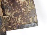 a close up of a rusty metal object on a white background