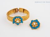 pair of gold and blue enamel flower rings and earrings
