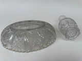 a glass container with a lid on a white table