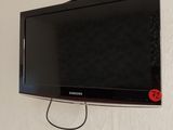 a flat screen tv hanging on the wall in the room