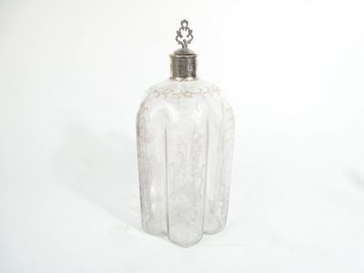 an image of a clear glass bottle with a silver lid