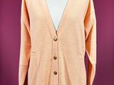 an orange cardigan sweater on a mannequin mannequin mannequin mannequin mannequin mannequin mannequin mannequin mann