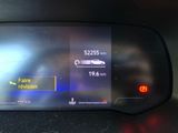 the dashboard of a car with a digital display showing the speed of a car