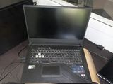 a laptop computer that is sitting on a desk