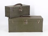two suitcases sitting on top of each other on a white surface