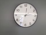 a clock that is on the wall in the room