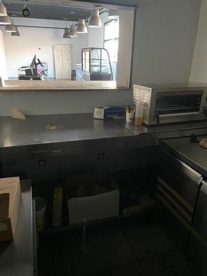 an image of a kitchen with a sink and a microwave