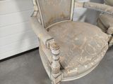 a chair that is sitting in the corner of a room