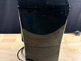 an image of a black coffee maker on a wooden table