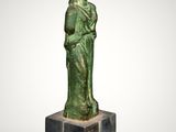 a statue of a woman with a hat on her head