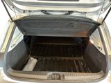 a trunk of a car with the back door open