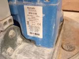 a blue machine that is sitting on top of a table