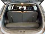 two seats in the back of a car with the trunk open