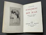 an open book with a drawing of a woman ' s face on it