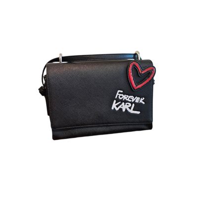 a black purse with a red heart on it